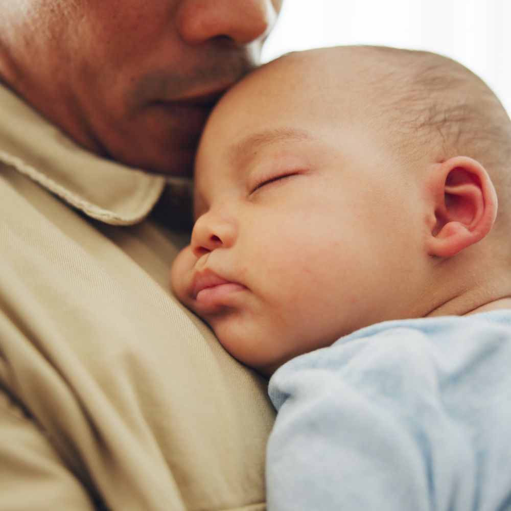 Baby, sleep on father chest for tired rest