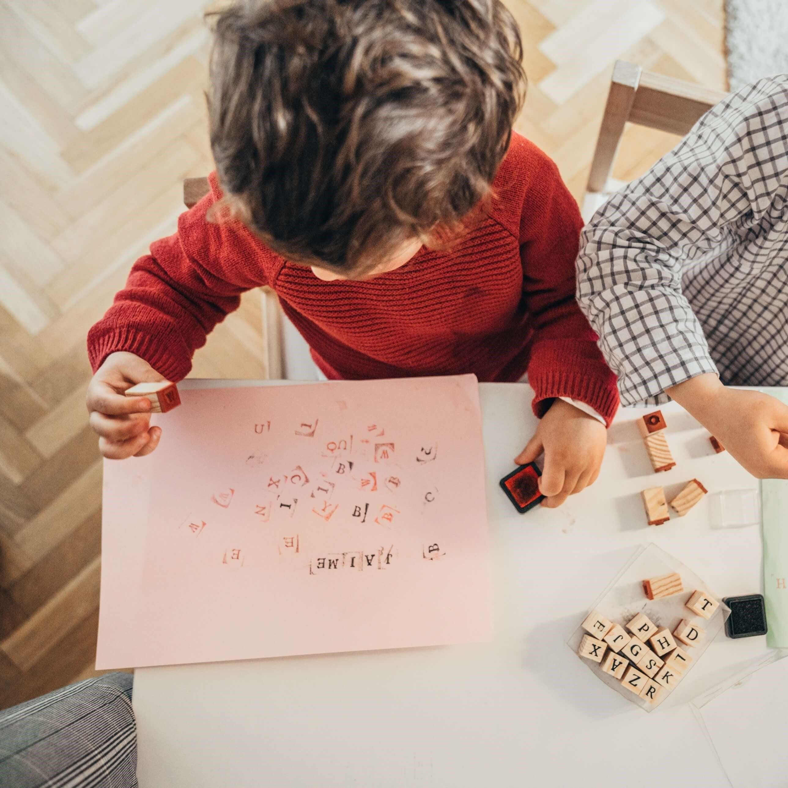 boys are drawing at home