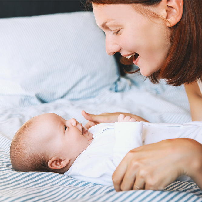 Mom spends time and talks with her little child at home