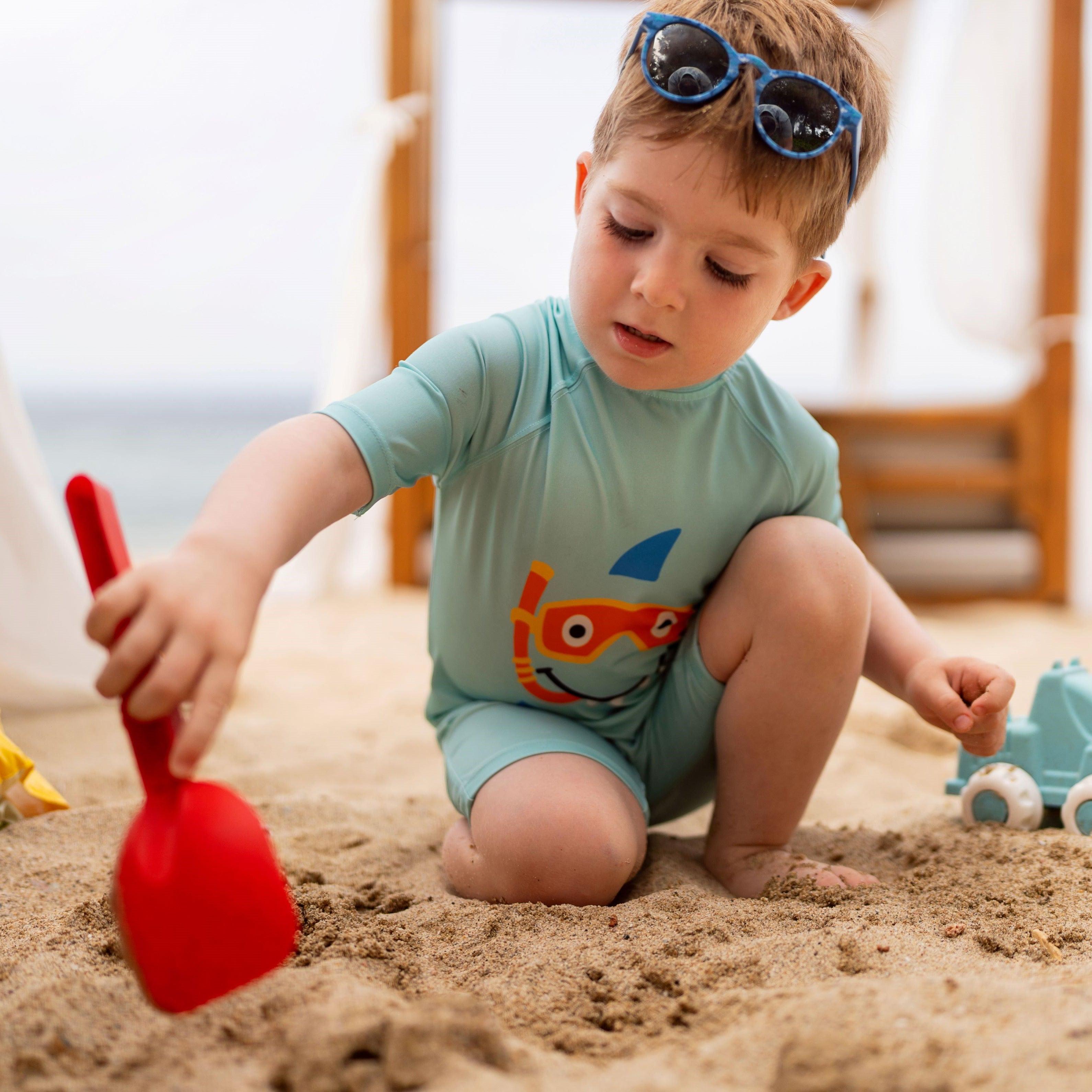 Little boy playing on the beach